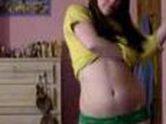 Youthful legal age teenager bedroom strip, yellow top and little green panties cast aside showing her little billibongs and pussy.