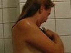 Girlie doesn't shy to be filmed on camera naked. She proceeds showering, when her stud enters bathroom.
